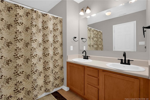 195 Cape Fear Rd, Raeford, NC 28376 - full bathroom with double vanity, a shower with shower curtain, and tile patterned floors