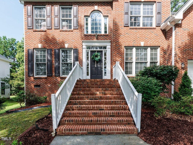 313 Hardwick Dr, Durham, NC 27713 - view of exterior entry featuring brick siding