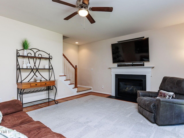 313 Hardwick Dr, Durham, NC 27713 - living room featuring stairway, wood finished floors, a ceiling fan, recessed lighting, and a fireplace with flush hearth