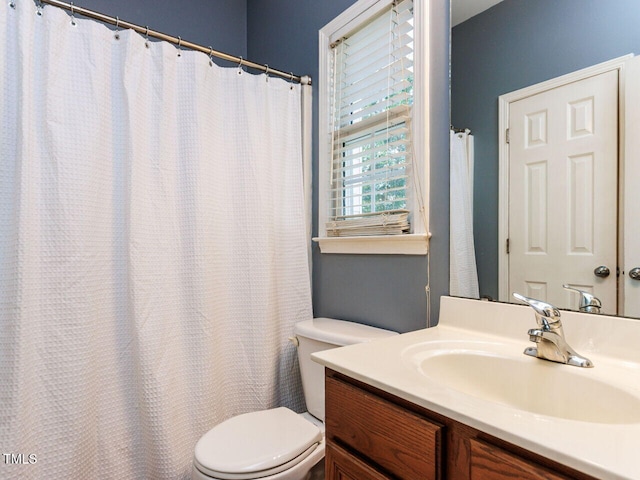 313 Hardwick Dr, Durham, NC 27713 - full bathroom with vanity and a shower with shower curtain
