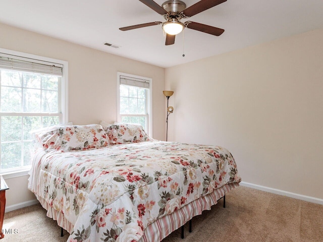 313 Hardwick Dr, Durham, NC 27713 - carpeted bedroom with baseboards and a ceiling fan