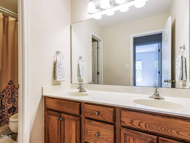 313 Hardwick Dr, Durham, NC 27713 - bathroom featuring double vanity and curtained shower