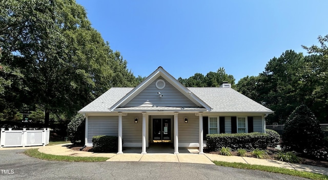 313 Hardwick Dr, Durham, NC 27713 - view of front of home featuring a chimney and a shingled roof