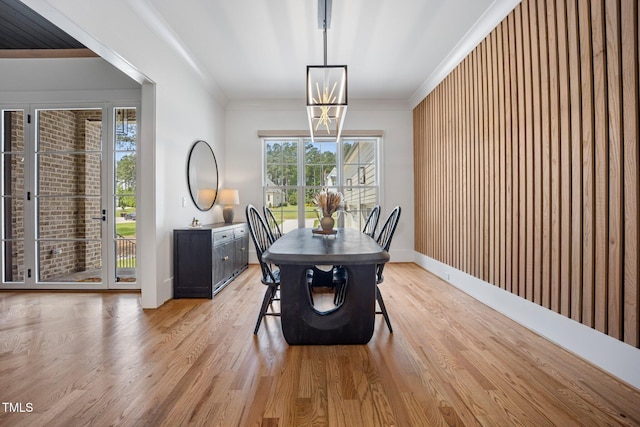 2713 Trifle Ln, Wake Forest, NC 27587 - dining space with plenty of natural light, light wood finished floors, baseboards, ornamental molding, and a chandelier