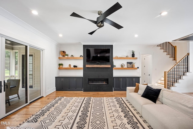 2713 Trifle Ln, Wake Forest, NC 27587 - living area with crown molding, stairway, light wood-type flooring, recessed lighting, and ceiling fan
