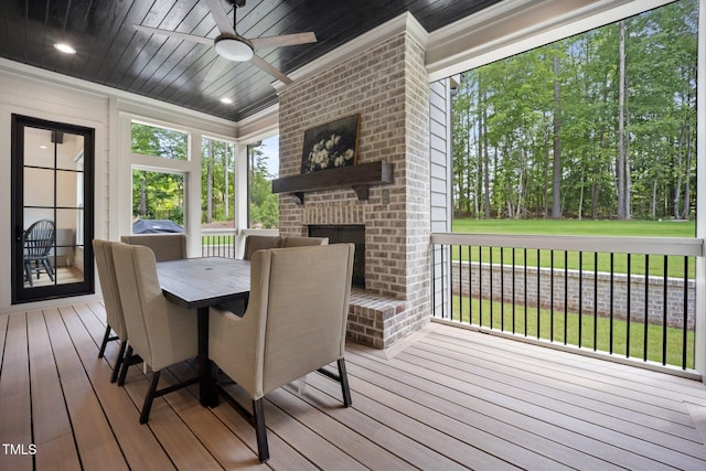 2713 Trifle Ln, Wake Forest, NC 27587 - sunroom featuring a fireplace, a ceiling fan, and outdoor dining area