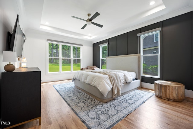 2713 Trifle Ln, Wake Forest, NC 27587 - bedroom with a raised ceiling, light wood-type flooring, recessed lighting, and a ceiling fan