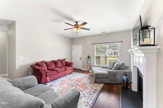 101 Rolling Knoll Ct, Dudley, NC 28333 - living room featuring a ceiling fan, wood finished floors, a fireplace, and baseboards