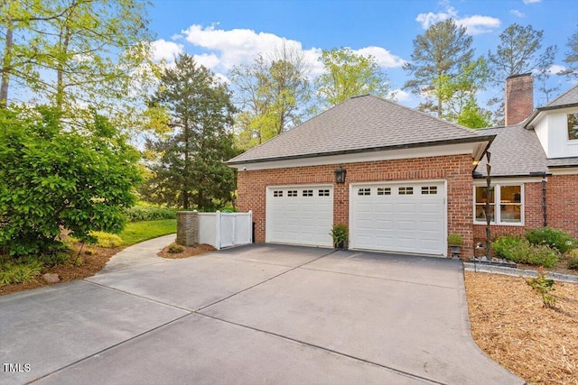 801 Pinehurst Dr, Chapel Hill, NC 27517 - view of property exterior featuring brick siding, concrete driveway, a garage, and roof with shingles