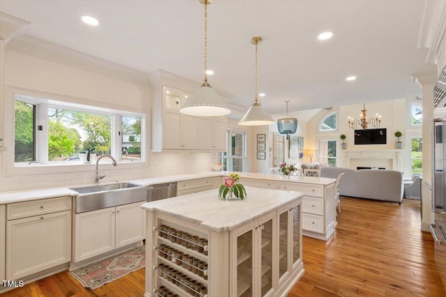 801 Pinehurst Dr, Chapel Hill, NC 27517 - kitchen with a sink, recessed lighting, a fireplace, a kitchen island, and a peninsula