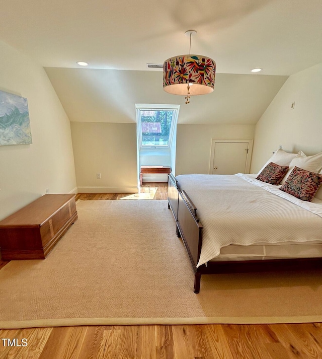 801 Pinehurst Dr, Chapel Hill, NC 27517 - bedroom featuring vaulted ceiling, wood finished floors, and recessed lighting