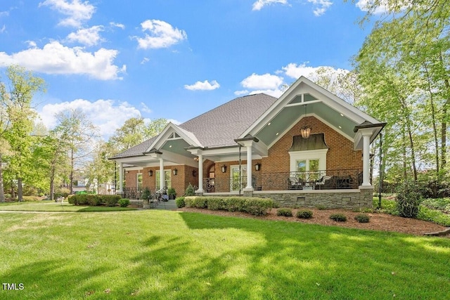801 Pinehurst Dr, Chapel Hill, NC 27517 - craftsman-style house featuring brick siding, a front yard, a porch, and roof with shingles