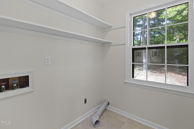 136 Sycamore St, Cary, NC 27513 - laundry room featuring baseboards, plenty of natural light, washer hookup, and tile patterned floors