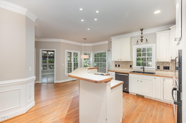 124 Cypress View Way, Apex, NC 27502 - kitchen featuring dishwasher, a sink, light wood-type flooring, white cabinetry, and tasteful backsplash