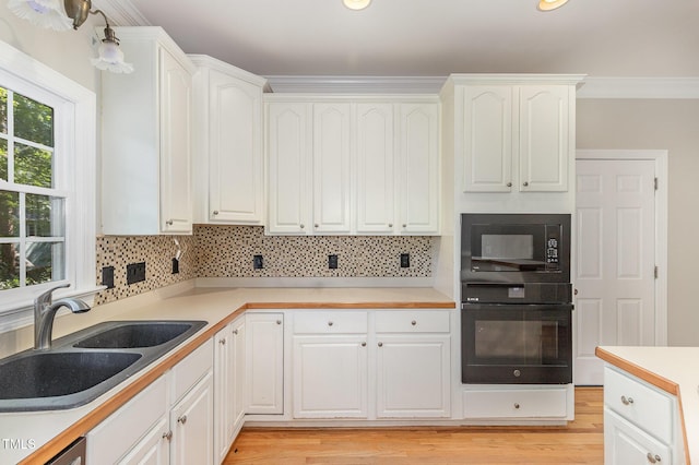 124 Cypress View Way, Apex, NC 27502 - kitchen with black appliances, a sink, tasteful backsplash, white cabinets, and recessed lighting