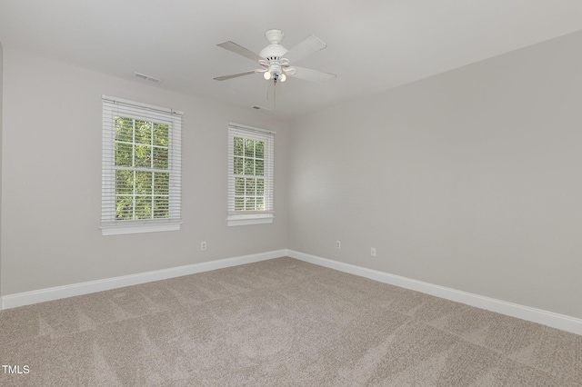 124 Cypress View Way, Apex, NC 27502 - unfurnished room with light colored carpet, a ceiling fan, and baseboards