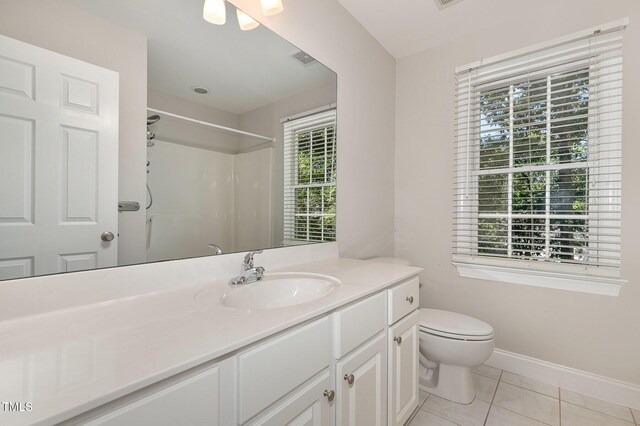 124 Cypress View Way, Apex, NC 27502 - full bath with vanity, toilet, a shower, tile patterned flooring, and baseboards