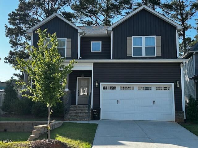 809 Trinity Park Dr, Wake Forest, NC 27587 - craftsman inspired home featuring a garage, stone siding, and driveway