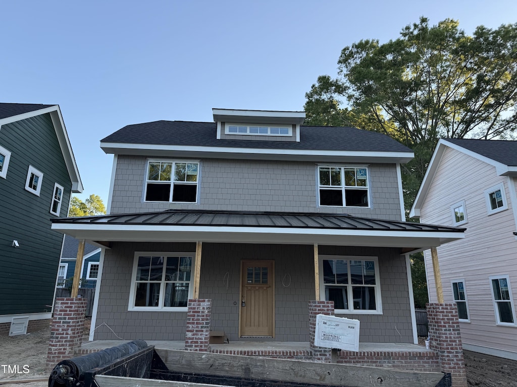 2658 Lawndale Ave, Durham, NC 27705 - view of front of house with covered porch, a standing seam roof, and metal roof