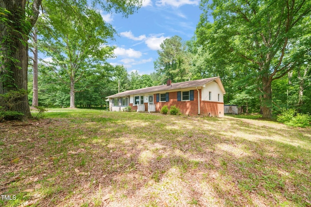 211 Cool Spring Rd, Durham, NC 27713 - view of front of house with brick siding, a chimney, and a front yard