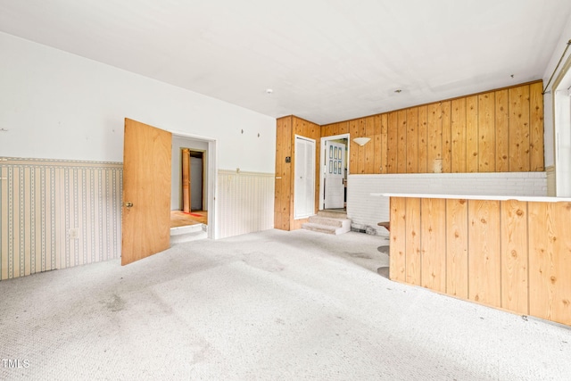 211 Cool Spring Rd, Durham, NC 27713 - carpeted empty room featuring wood walls