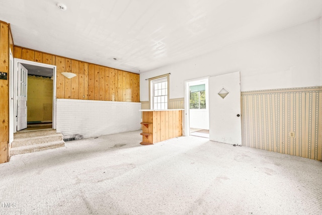 211 Cool Spring Rd, Durham, NC 27713 - empty room featuring wooden walls, carpet floors, a smoke detector, and a wainscoted wall