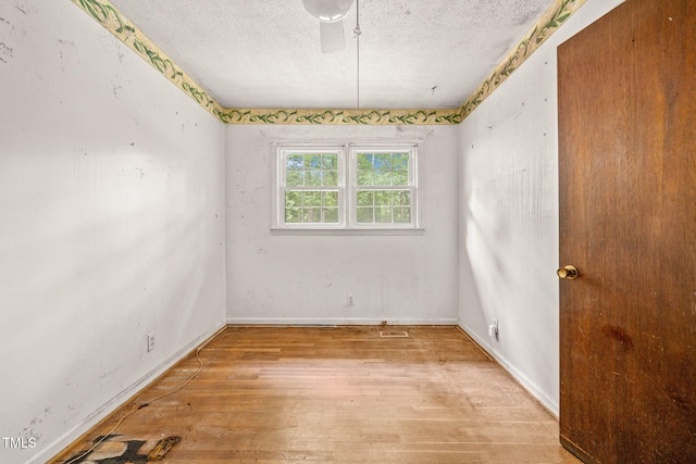 211 Cool Spring Rd, Durham, NC 27713 - unfurnished room featuring light wood-style floors, a textured ceiling, and baseboards