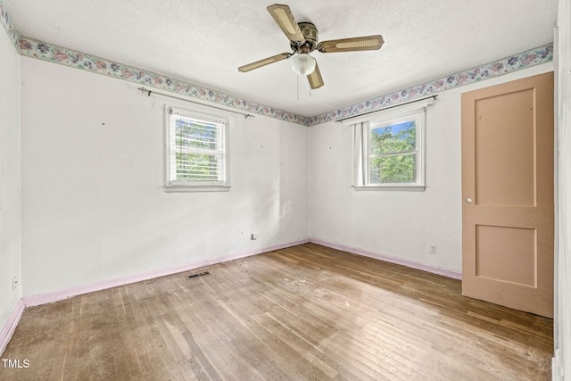 211 Cool Spring Rd, Durham, NC 27713 - unfurnished room featuring light wood finished floors, baseboards, a textured ceiling, and a ceiling fan