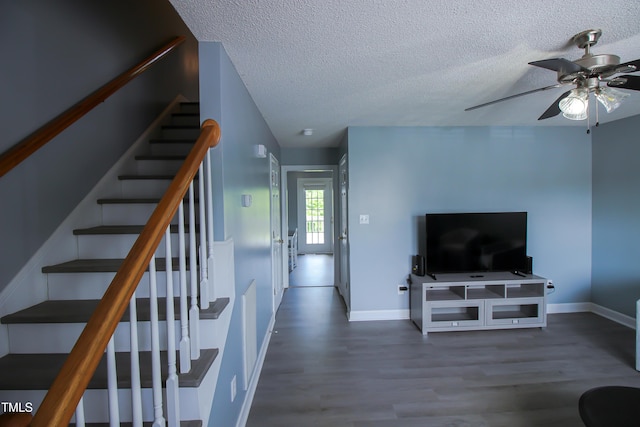 1806 Stroll Cir, Fuquay Varina, NC 27526 - staircase with wood finished floors, ceiling fan, a textured ceiling, and baseboards