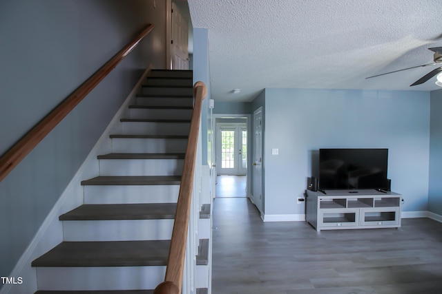 1806 Stroll Cir, Fuquay Varina, NC 27526 - stairs with a ceiling fan, a textured ceiling, wood finished floors, and baseboards