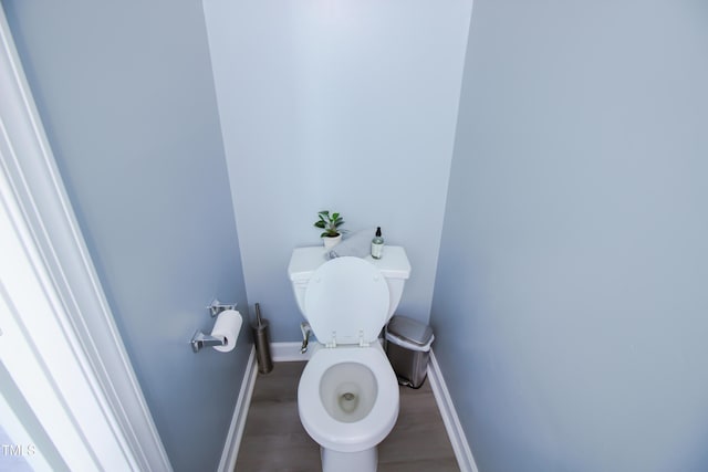 1806 Stroll Cir, Fuquay Varina, NC 27526 - bathroom featuring baseboards, wood finished floors, and toilet