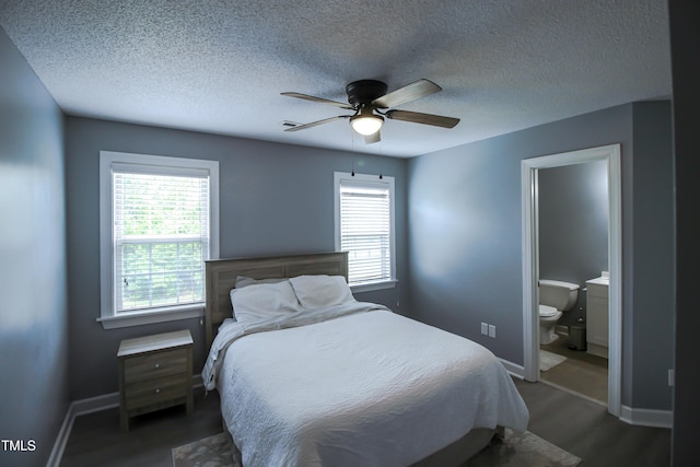 1806 Stroll Cir, Fuquay Varina, NC 27526 - bedroom featuring baseboards, wood finished floors, ensuite bath, a ceiling fan, and a textured ceiling
