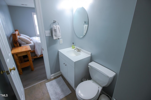 1806 Stroll Cir, Fuquay Varina, NC 27526 - ensuite bathroom featuring vanity, toilet, and tile patterned floors