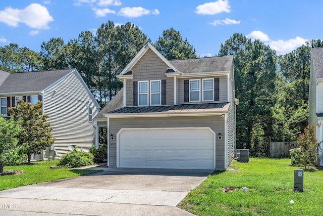 4009 Patriot Ridge Ct, Raleigh, NC 27610 - view of front of home featuring cooling unit, a standing seam roof, concrete driveway, an attached garage, and metal roof