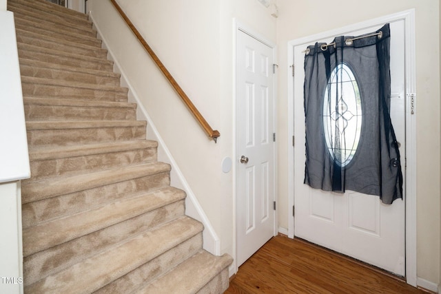 4009 Patriot Ridge Ct, Raleigh, NC 27610 - foyer with stairway and wood finished floors