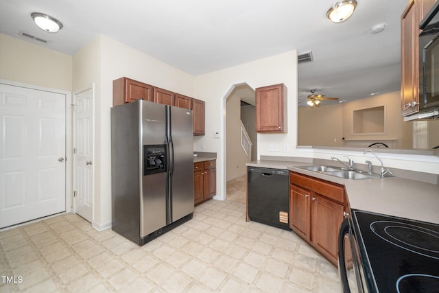 4009 Patriot Ridge Ct, Raleigh, NC 27610 - kitchen with black appliances, light floors, a sink, and ceiling fan