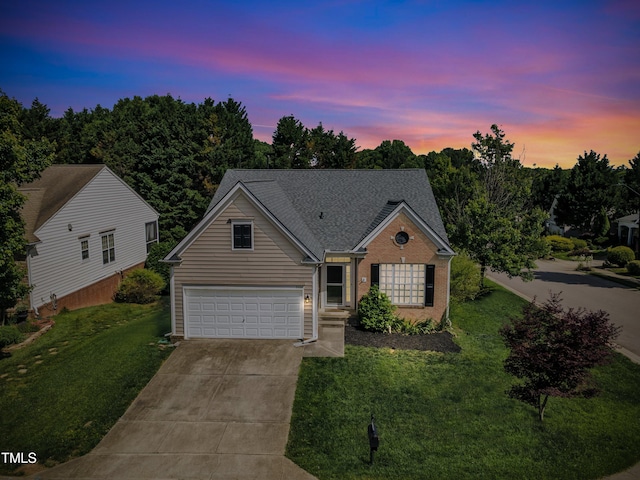 3400 Secretariat Way, Raleigh, NC 27614 - view of front of property with concrete driveway, a lawn, roof with shingles, and brick siding