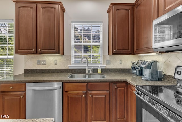 3400 Secretariat Way, Raleigh, NC 27614 - kitchen with appliances with stainless steel finishes, a sink, and decorative backsplash
