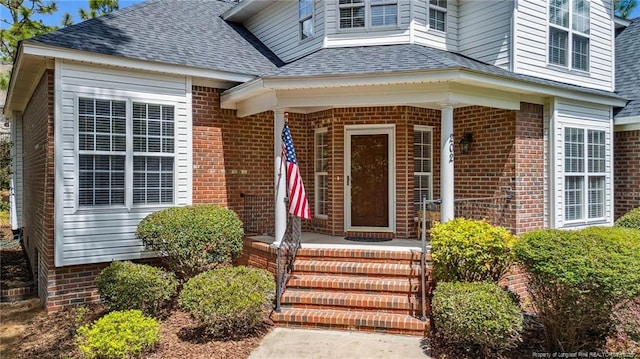 202 Juniper Creek Blvd, Pinehurst, NC 28374 - view of exterior entry with brick siding and roof with shingles