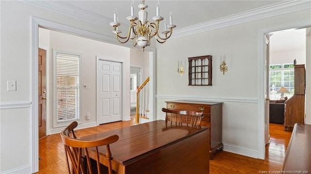 202 Juniper Creek Blvd, Pinehurst, NC 28374 - dining space featuring a chandelier, wood finished floors, ornamental molding, and baseboards