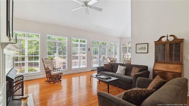 202 Juniper Creek Blvd, Pinehurst, NC 28374 - living room with high vaulted ceiling, ceiling fan, and light wood-style flooring