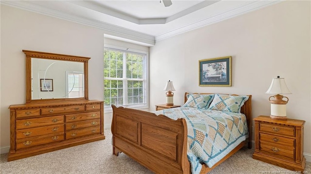 202 Juniper Creek Blvd, Pinehurst, NC 28374 - carpeted bedroom featuring ornamental molding, a tray ceiling, ceiling fan, and baseboards