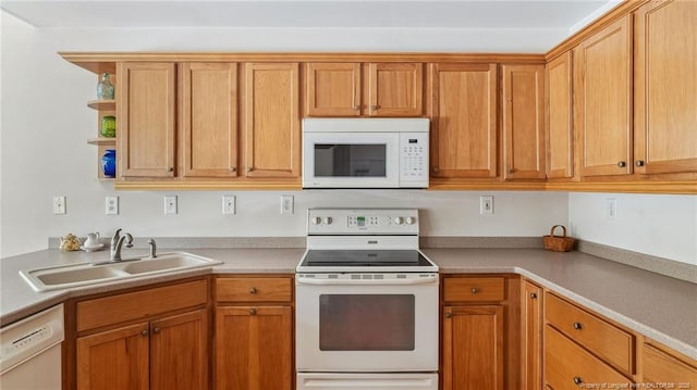 202 Juniper Creek Blvd, Pinehurst, NC 28374 - kitchen with white appliances, a sink, light countertops, open shelves, and brown cabinets