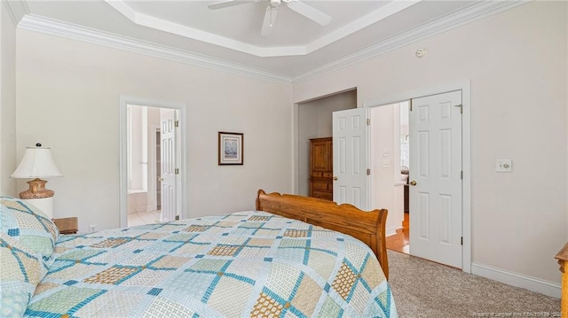 202 Juniper Creek Blvd, Pinehurst, NC 28374 - bedroom featuring a raised ceiling, ornamental molding, carpet, a ceiling fan, and ensuite bathroom