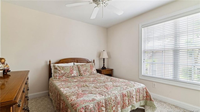 202 Juniper Creek Blvd, Pinehurst, NC 28374 - carpeted bedroom featuring multiple windows, baseboards, and ceiling fan
