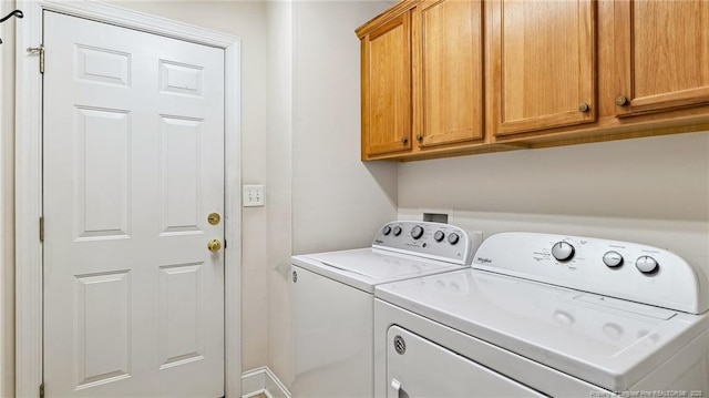202 Juniper Creek Blvd, Pinehurst, NC 28374 - washroom featuring washer and clothes dryer and cabinet space