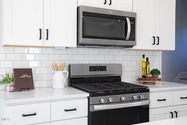 1514 W Knox St, Durham, NC 27705 - kitchen with stainless steel appliances, white cabinets, and backsplash