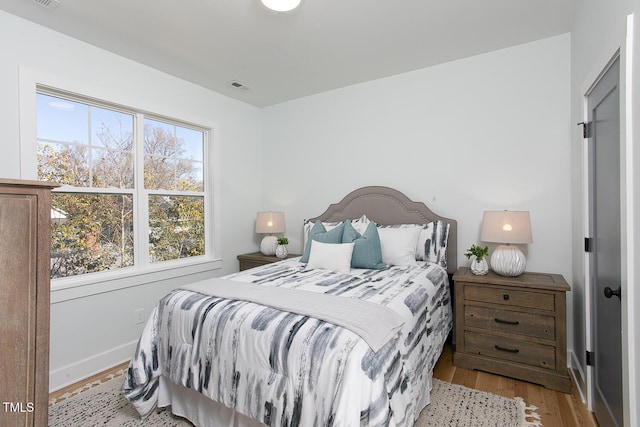 1514 W Knox St, Durham, NC 27705 - bedroom with wood finished floors
