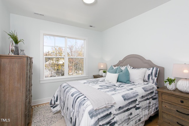 1514 W Knox St, Durham, NC 27705 - bedroom with baseboards and wood finished floors