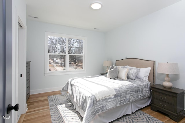 1514 W Knox St, Durham, NC 27705 - bedroom featuring baseboards and light wood-style flooring